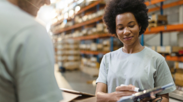 Woman in green top at warehouse