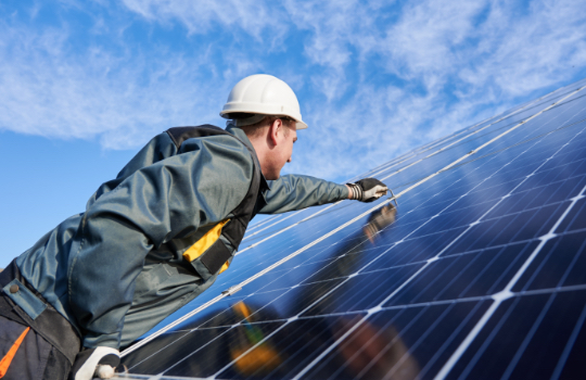 Technicians working on solar panels