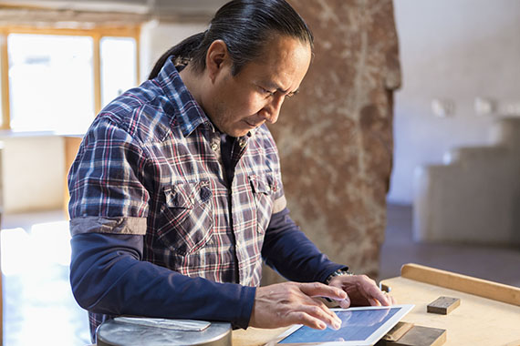 Image of Native American artist representing EDC’s inclusive trade strategy.